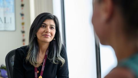 Mental health counselor meeting with a patient in an office setting