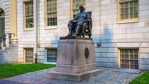 Bronze statue of John Harvard located on the campus of Harvard University in Cambridge, Massachusetts.