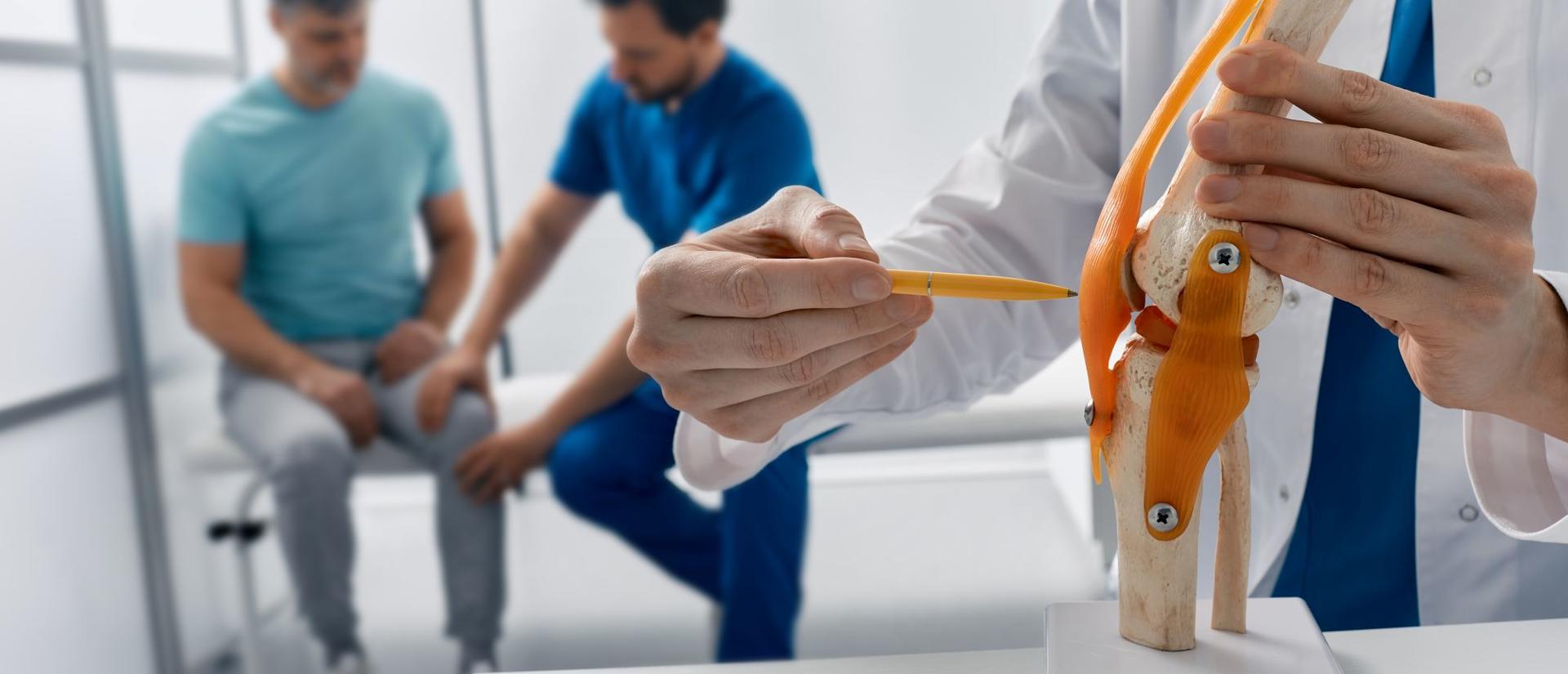 Treatment for knee injuries. Adult man with knee injury during consultation with doctor traumatologist at medical clinic