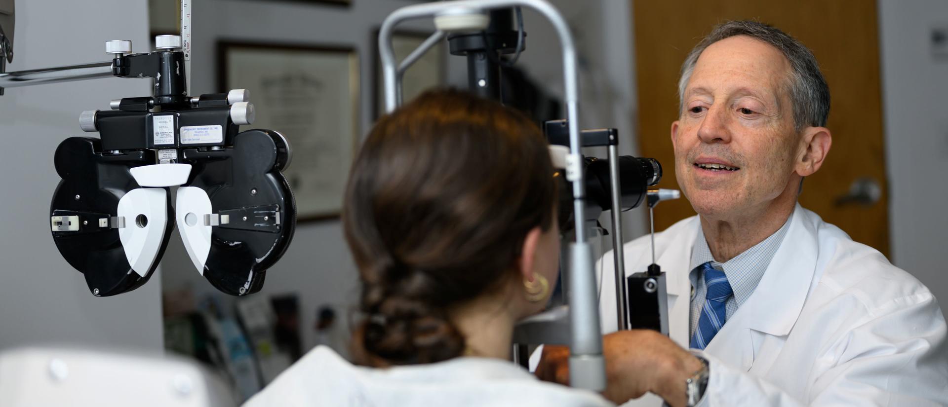 Eye Care Center physician administering an eye exam